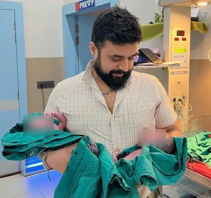 Dr. Shashikant with newborns in the NICU